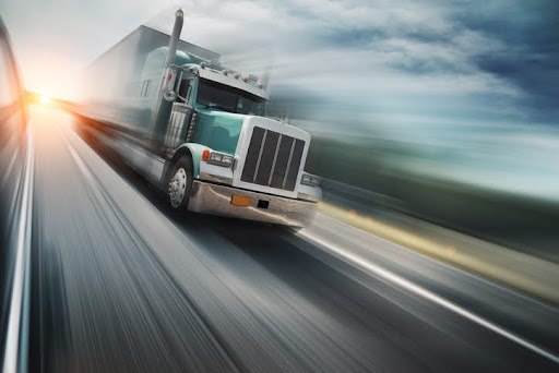 American truck speeding on freeway