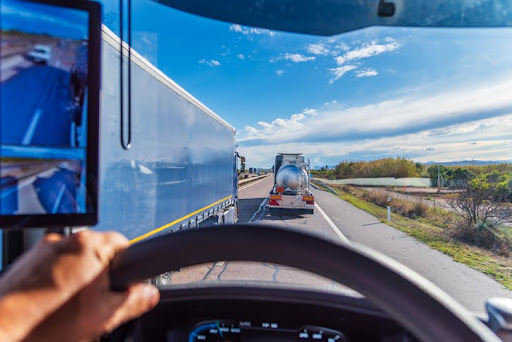 Truck overtaking two other trucks